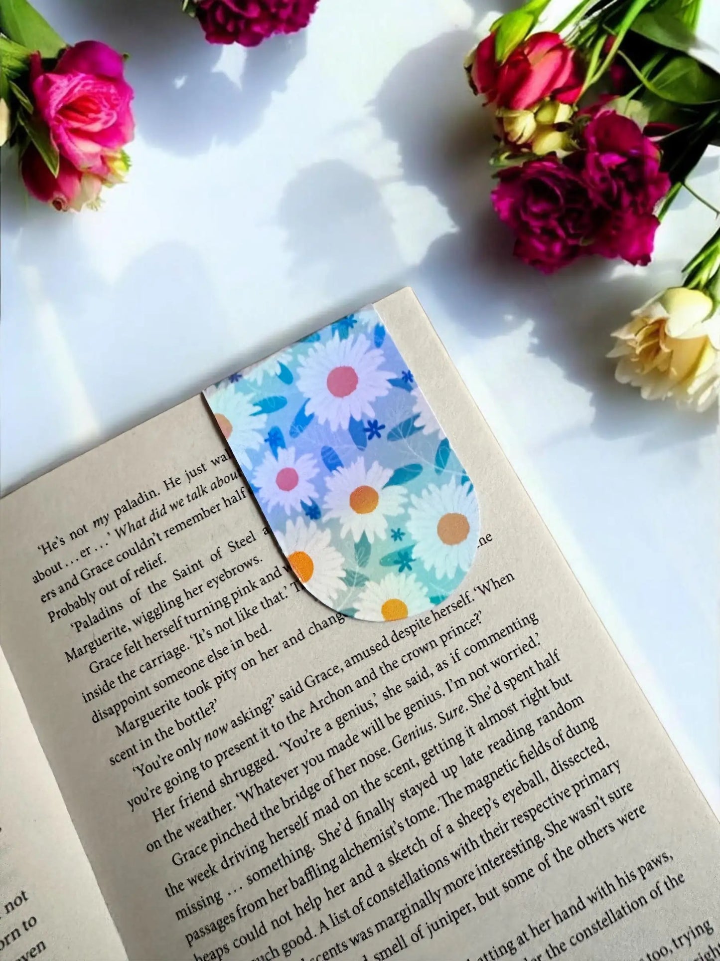 Daisy Floral blue and white daisy holographic magnetic bookmark placed in an open book by Enchanted Bookcase