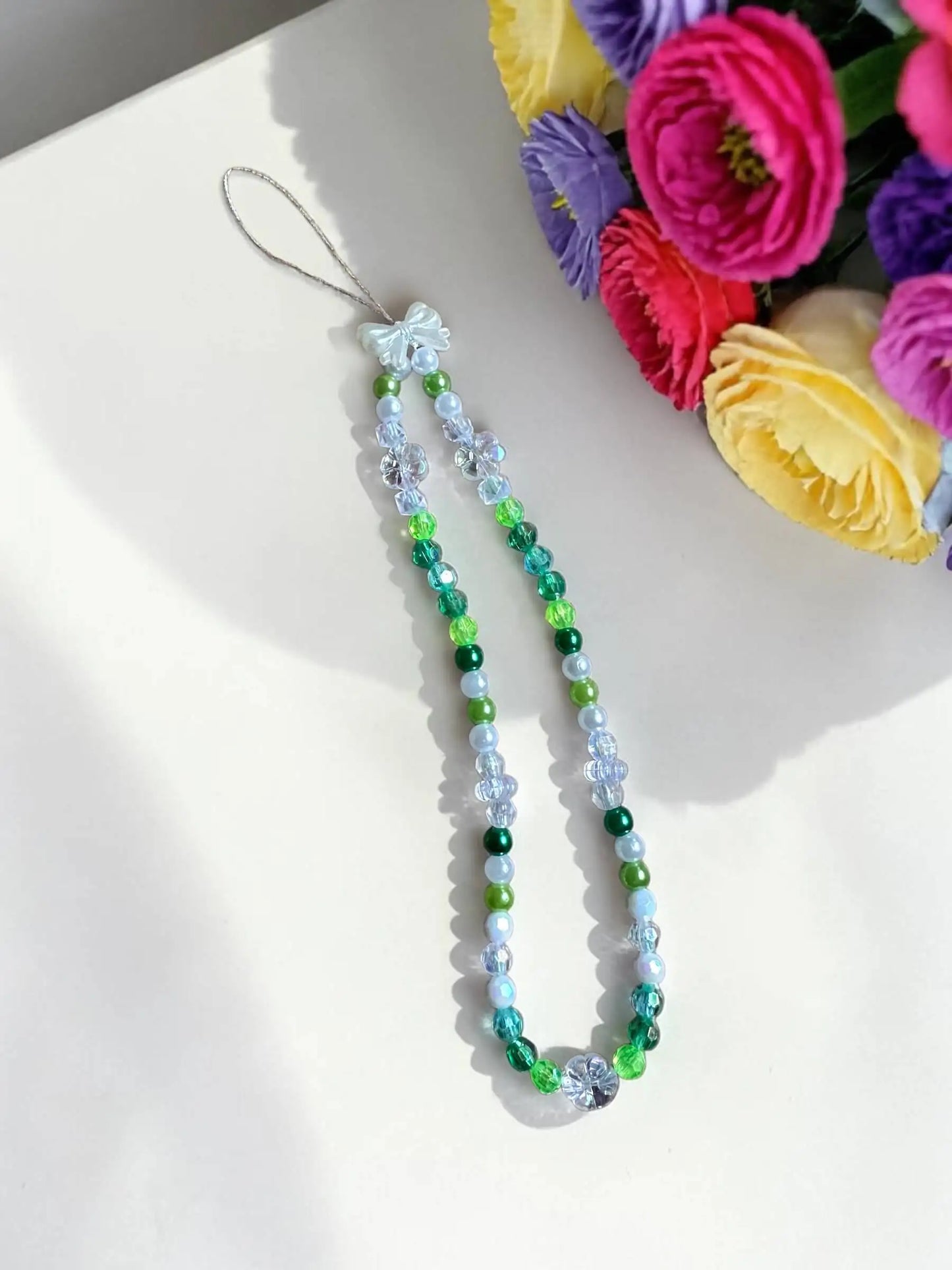 Emerald Dream handmade beaded phone chain with green teal crystals, pearls and white bow charm by Enchanted Bookcase