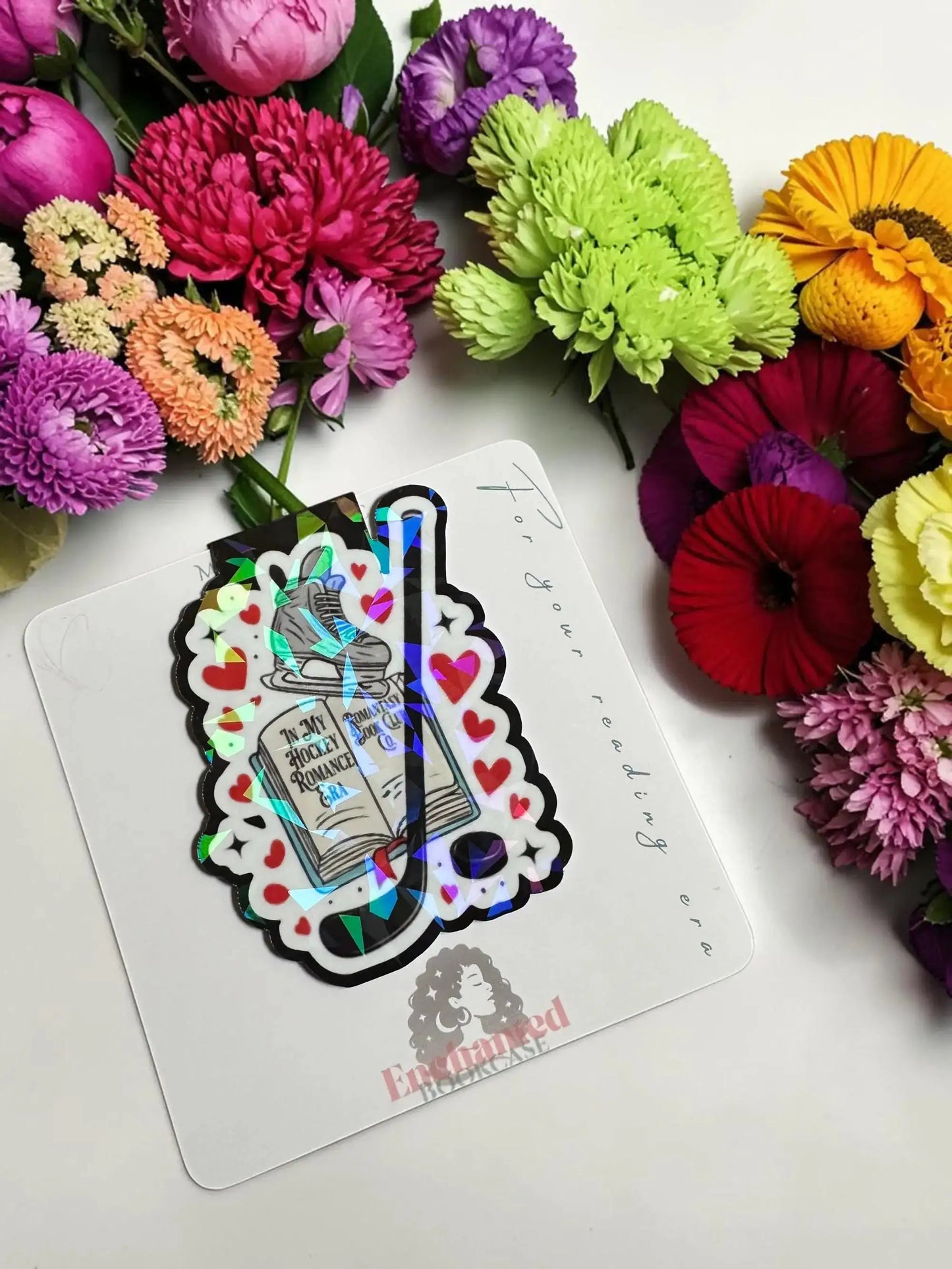 In My Hockey Romance Era open book with hockey skate and stick holographic magnetic bookmark by Enchanted Bookcase