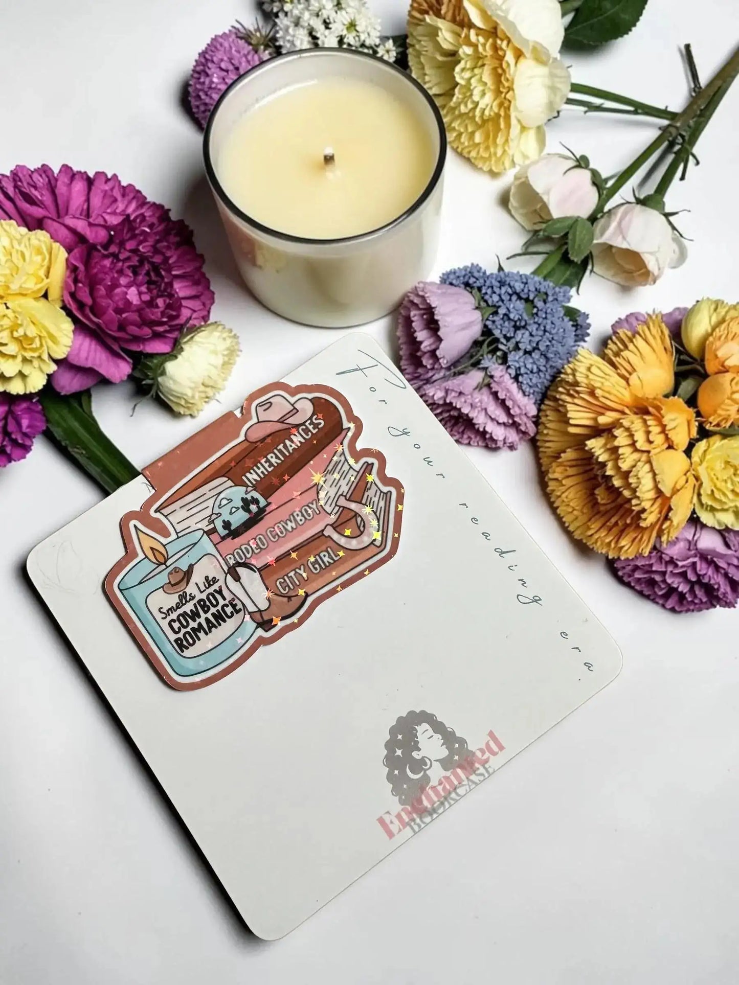Smells Like Cowboy Romance candle and book stack holographic magnetic bookmark by Enchanted Bookcase